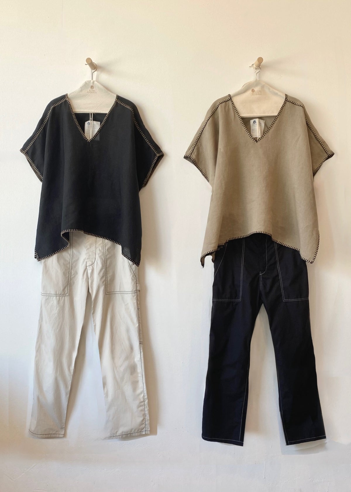Black tunic over beige pants and dark tan tunic over black pants