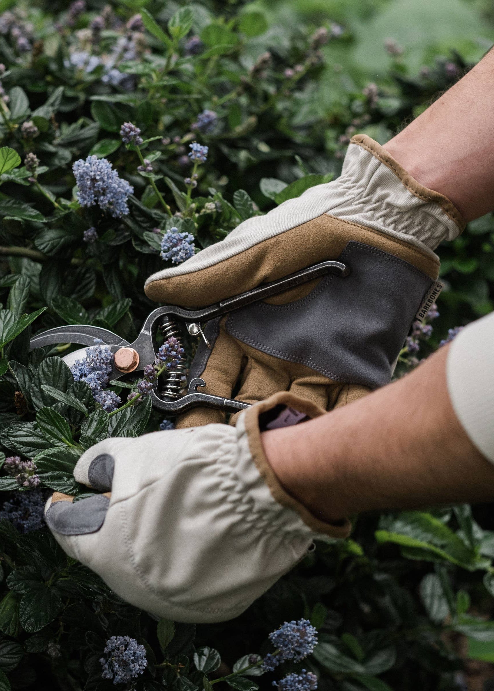lifestyle gloved hands using pruner