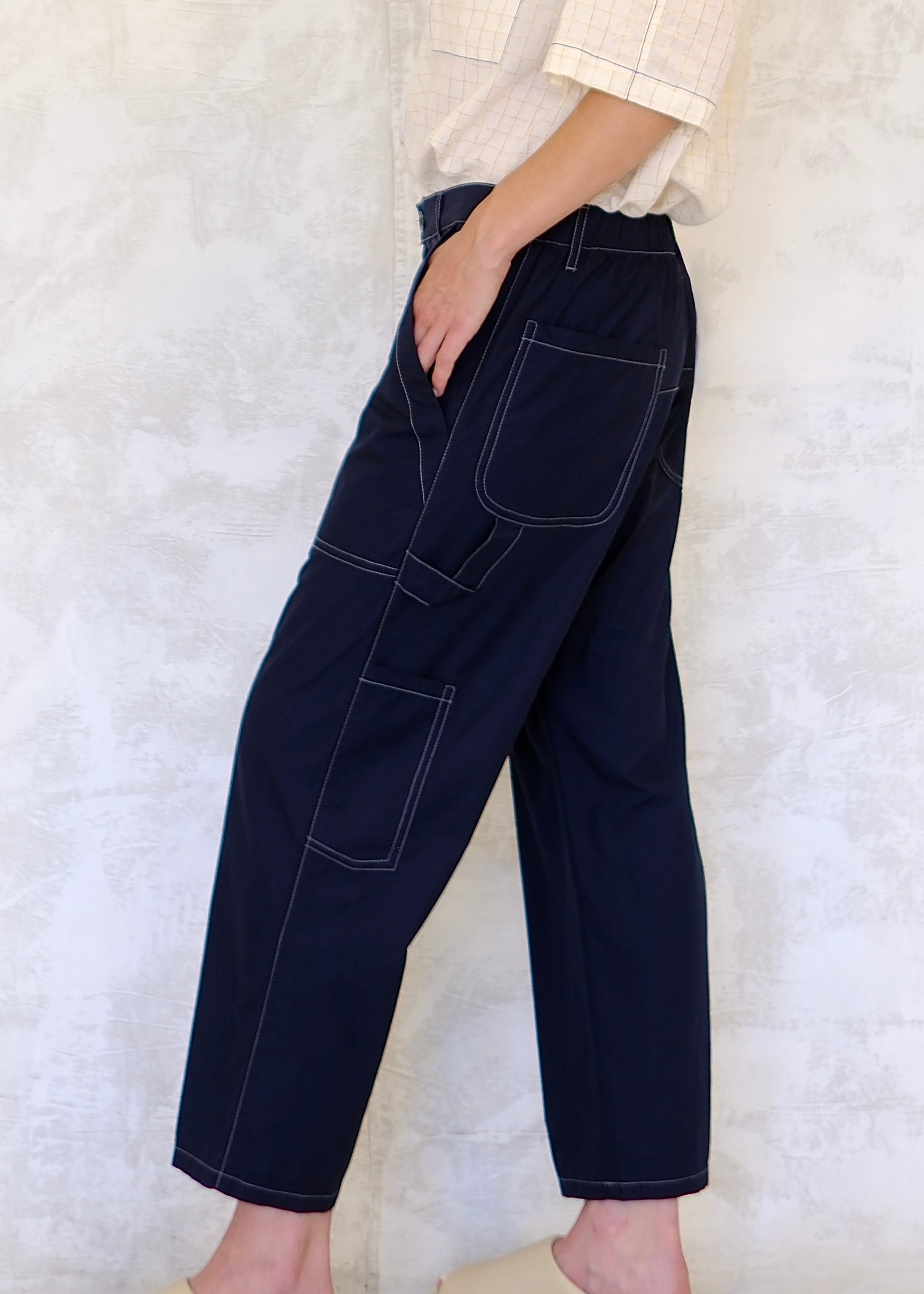side view navy poplin pants with contrast stitching, pockets and utility loop