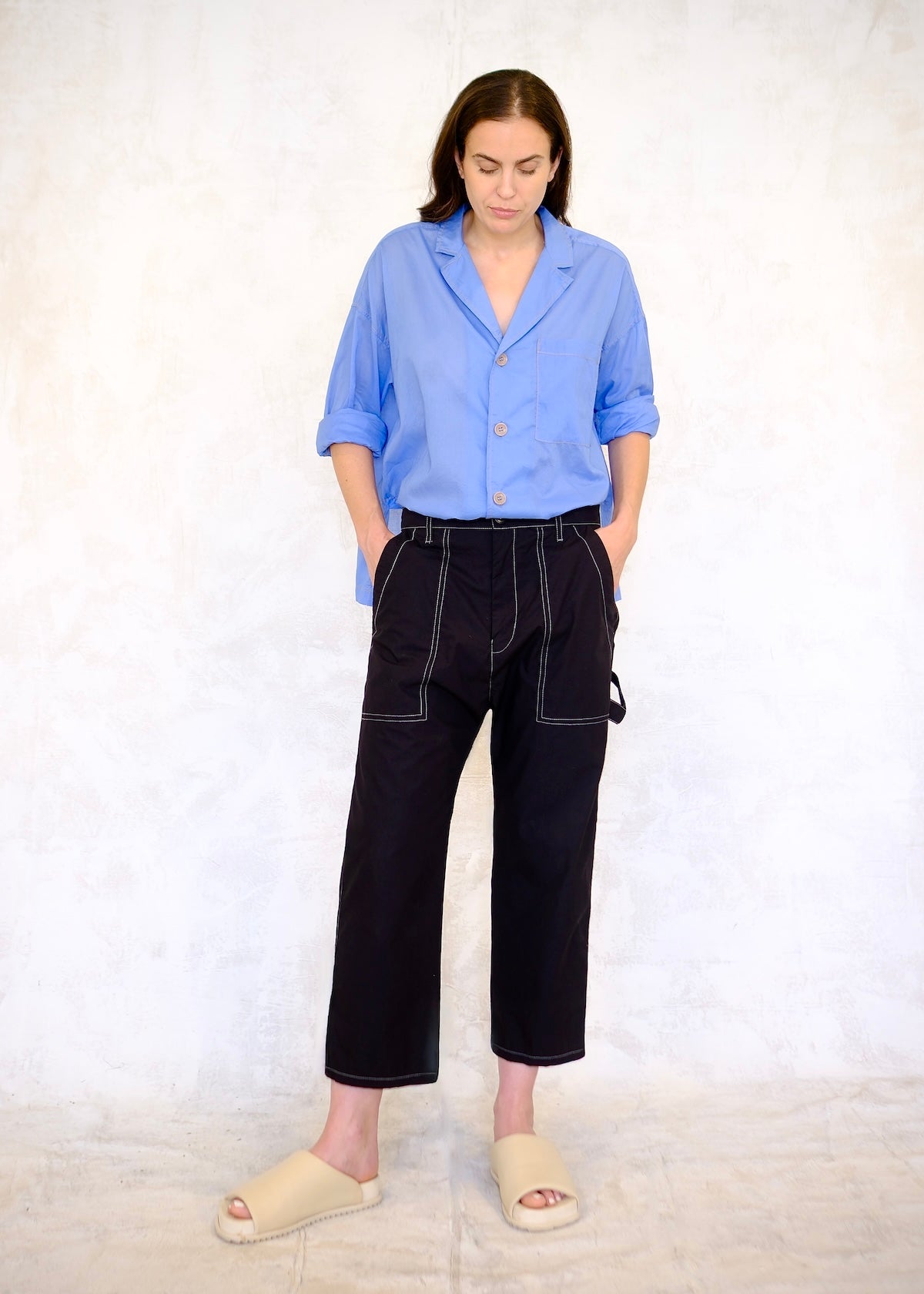 black poplin pants with large front pockets, sky blue top