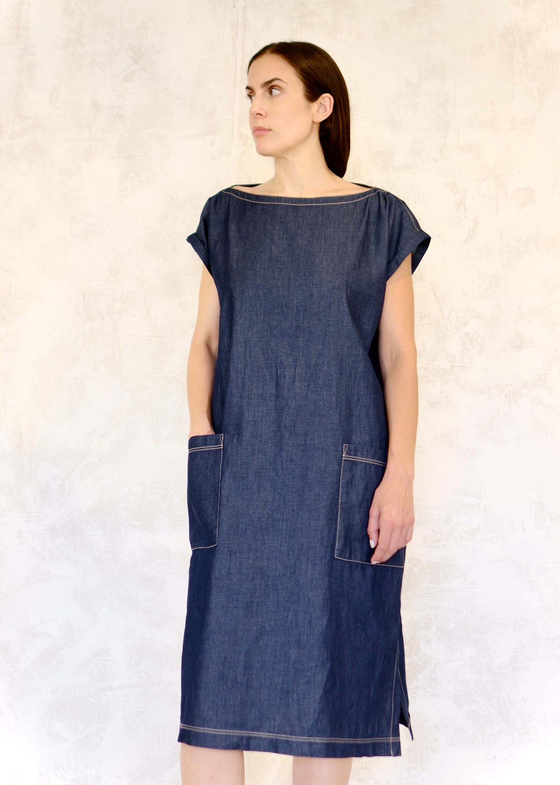 loose cap sleeve denim boat neck dress with hand in pocket