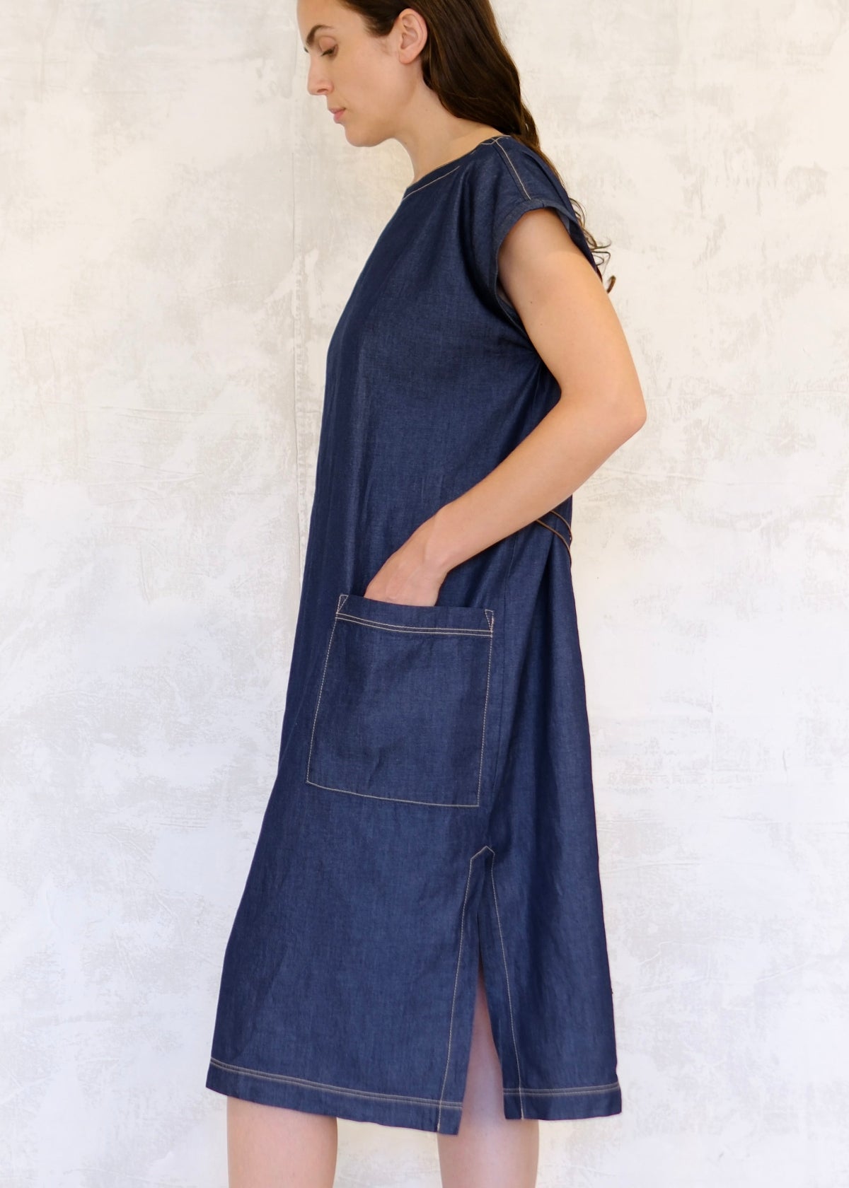denim boat neck dress hand in pocket side view