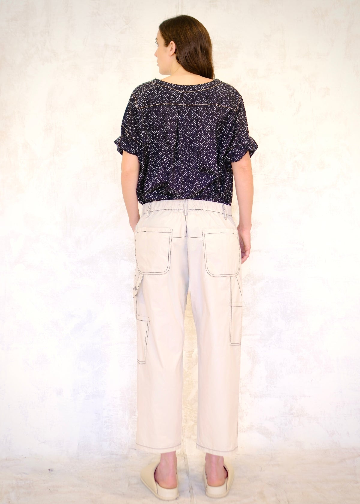 rear view of white poplin pants, pockets, tool pockets, tool loop