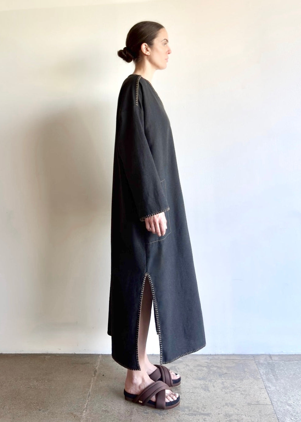 Flannel Poet Dress in soft rayon–cotton blend, shown in front to side view with V-neckline, side pocket, slit and long sleeves.