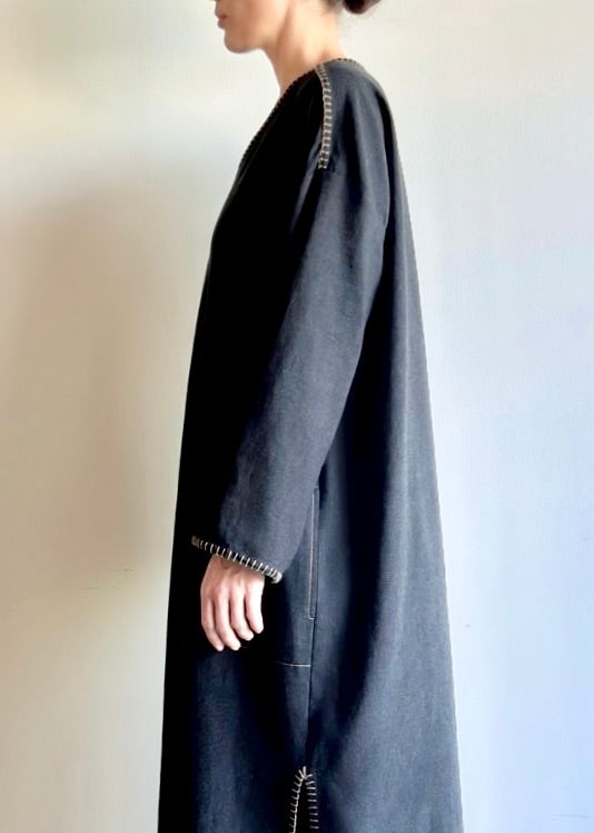 Close-up of the rayon–cotton flannel fabric, showing its soft texture and contrast edge stitching