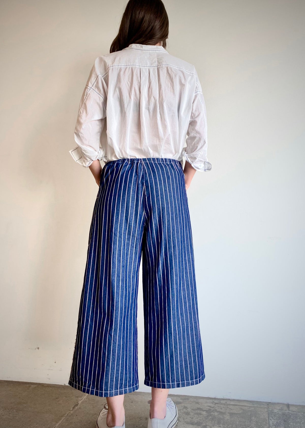 blue and white striped denim cropped drawstring pants with white top rear view