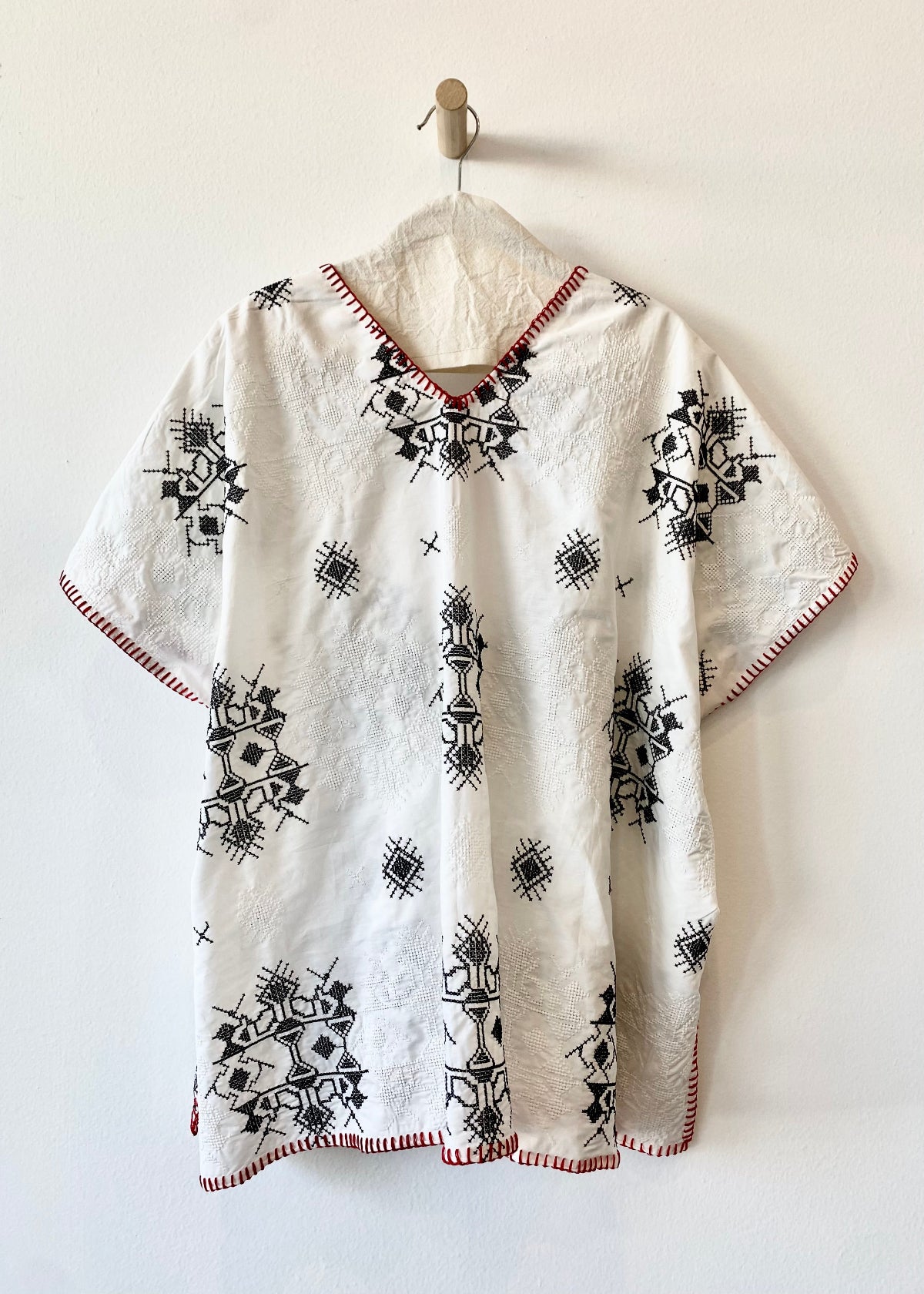 white embroidered tunic with red blanket stitching short sleeves back