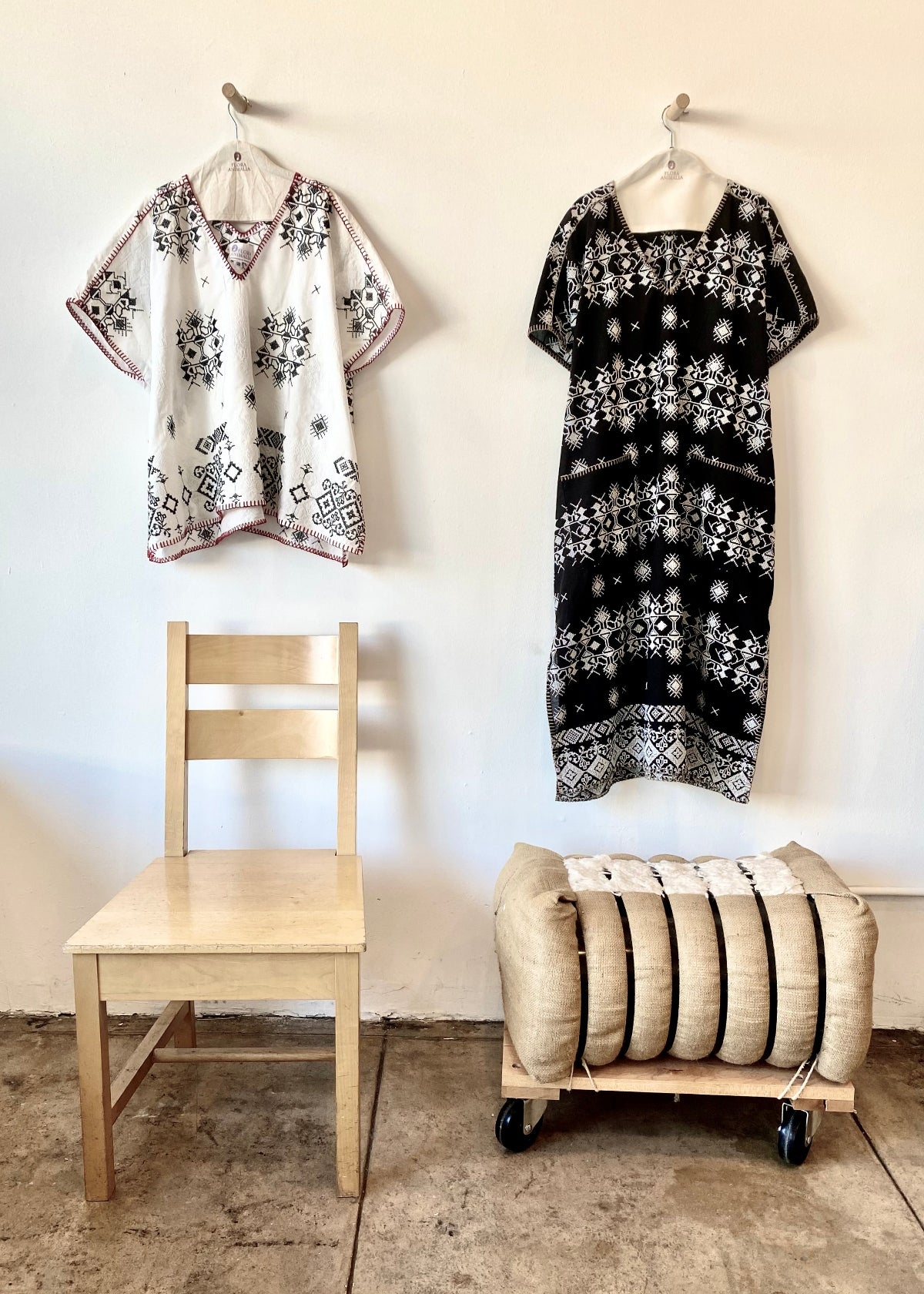 white embroidered tunic and black embroidered dress