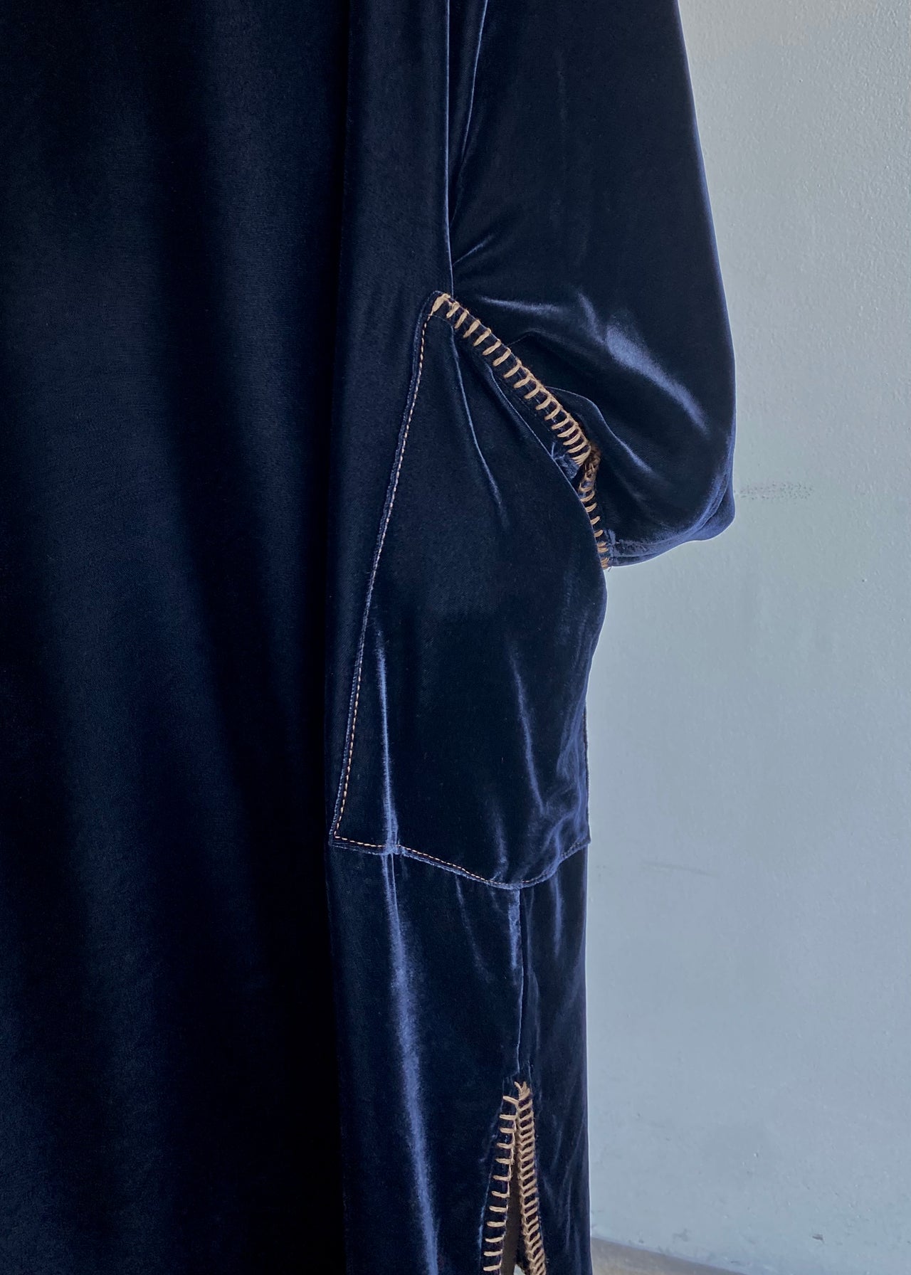 Velvet Poet Dress styled simply, showing elegant drape, v-neck and luminous texture in motion.