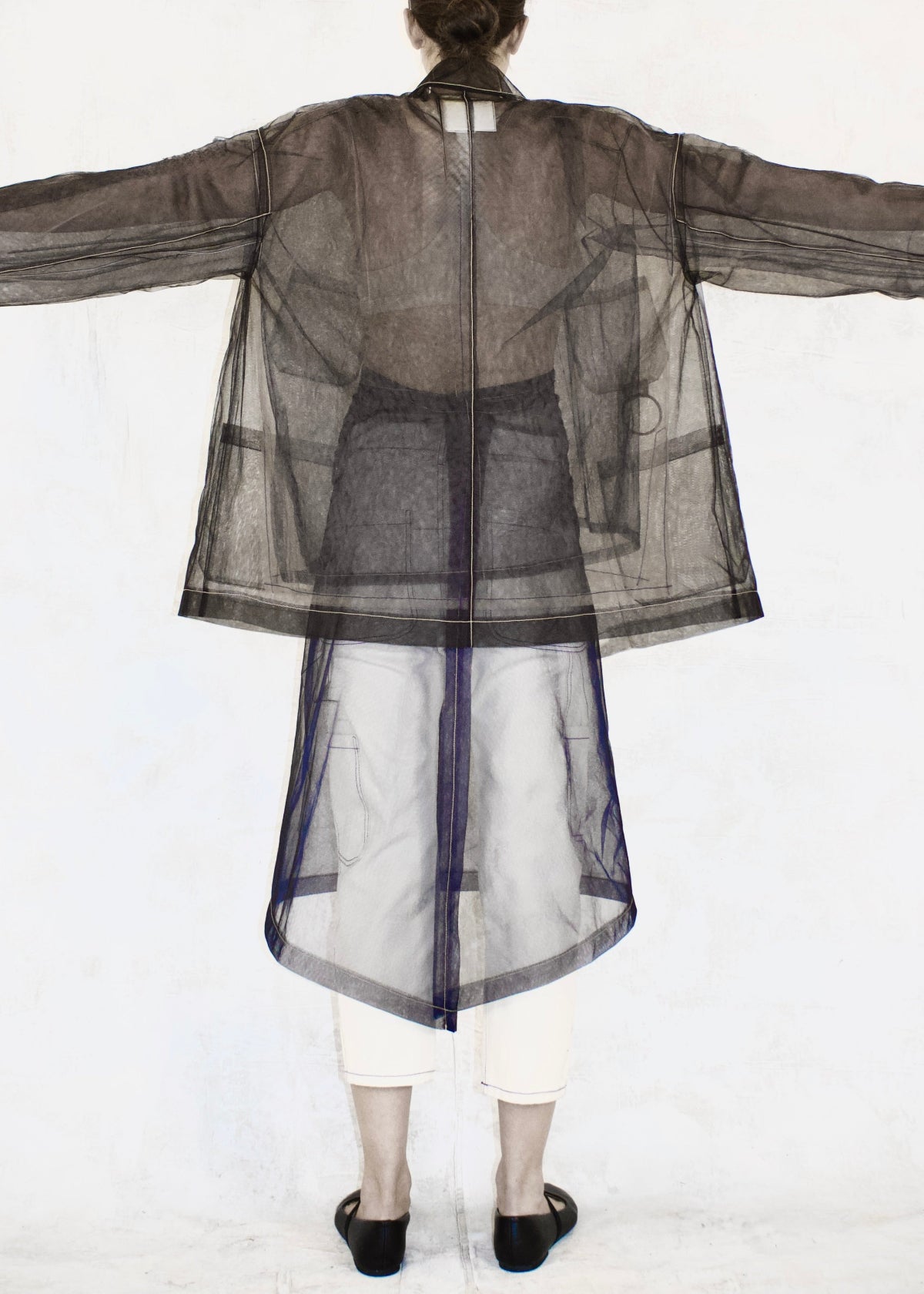 black sheer jacket 4 pockets long sleeve with sheer half apron rear view