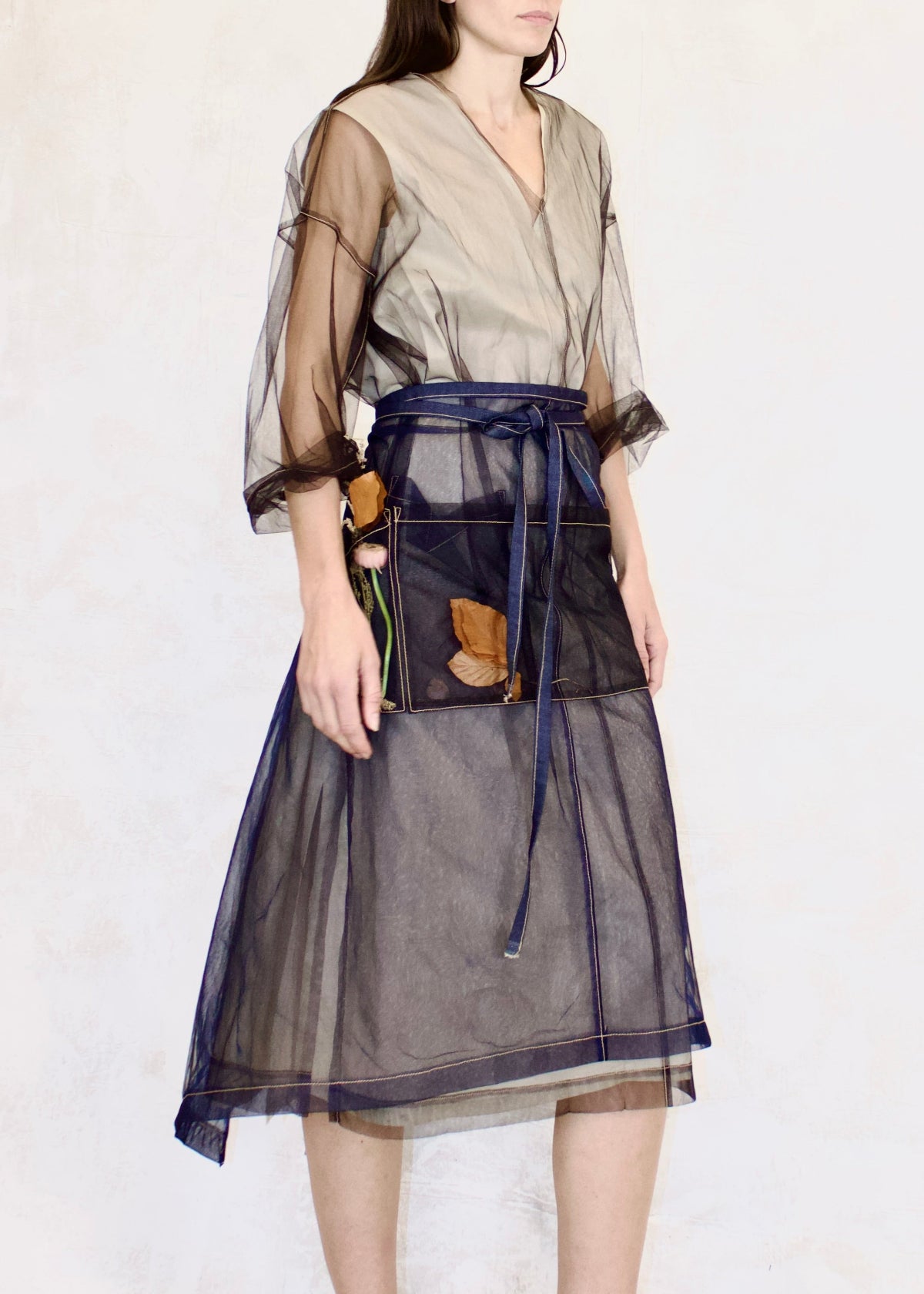 sheer half apron with sheer front pockets and tie waist