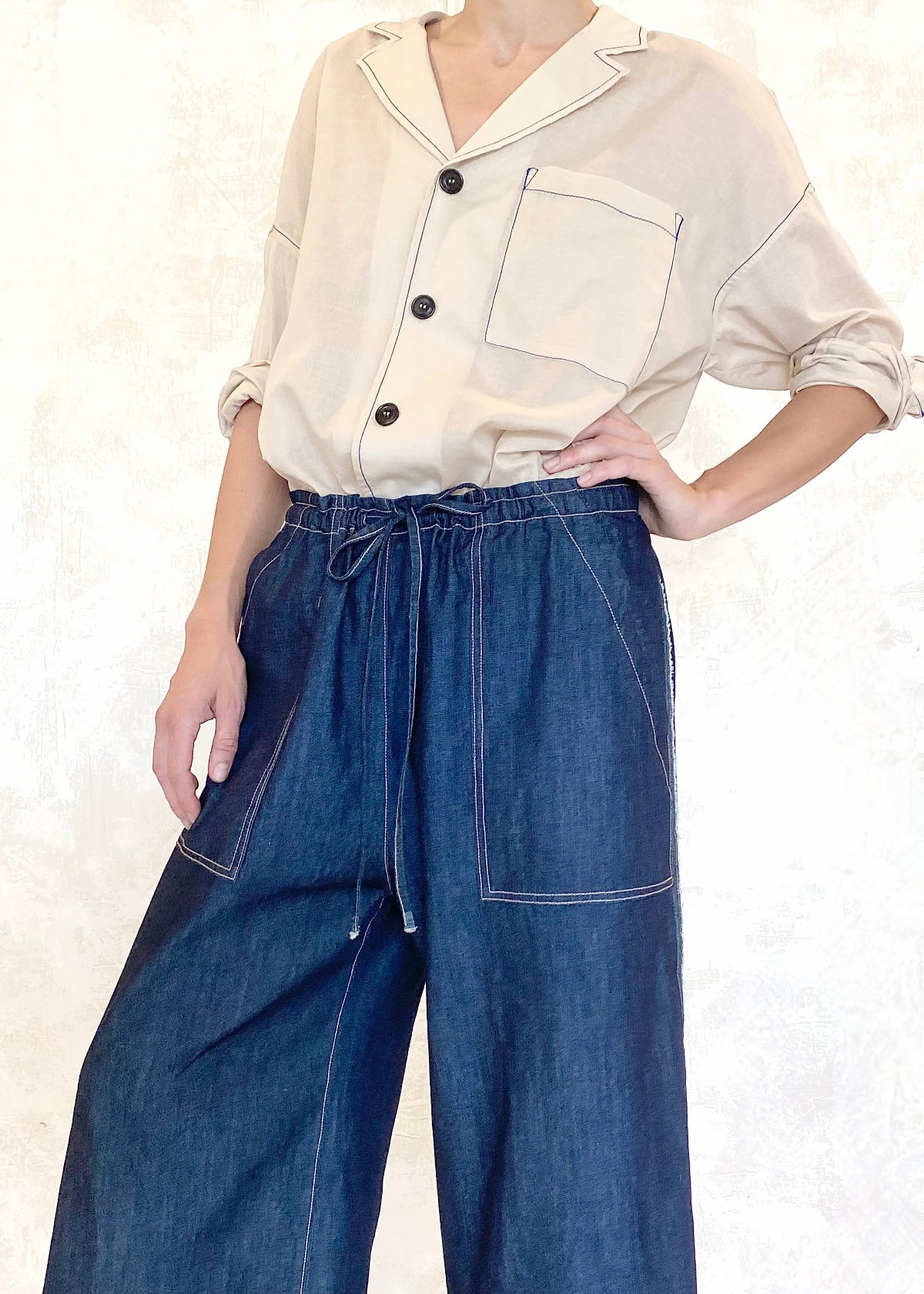 denim drawstring jeans with beige button down top, patch pockets