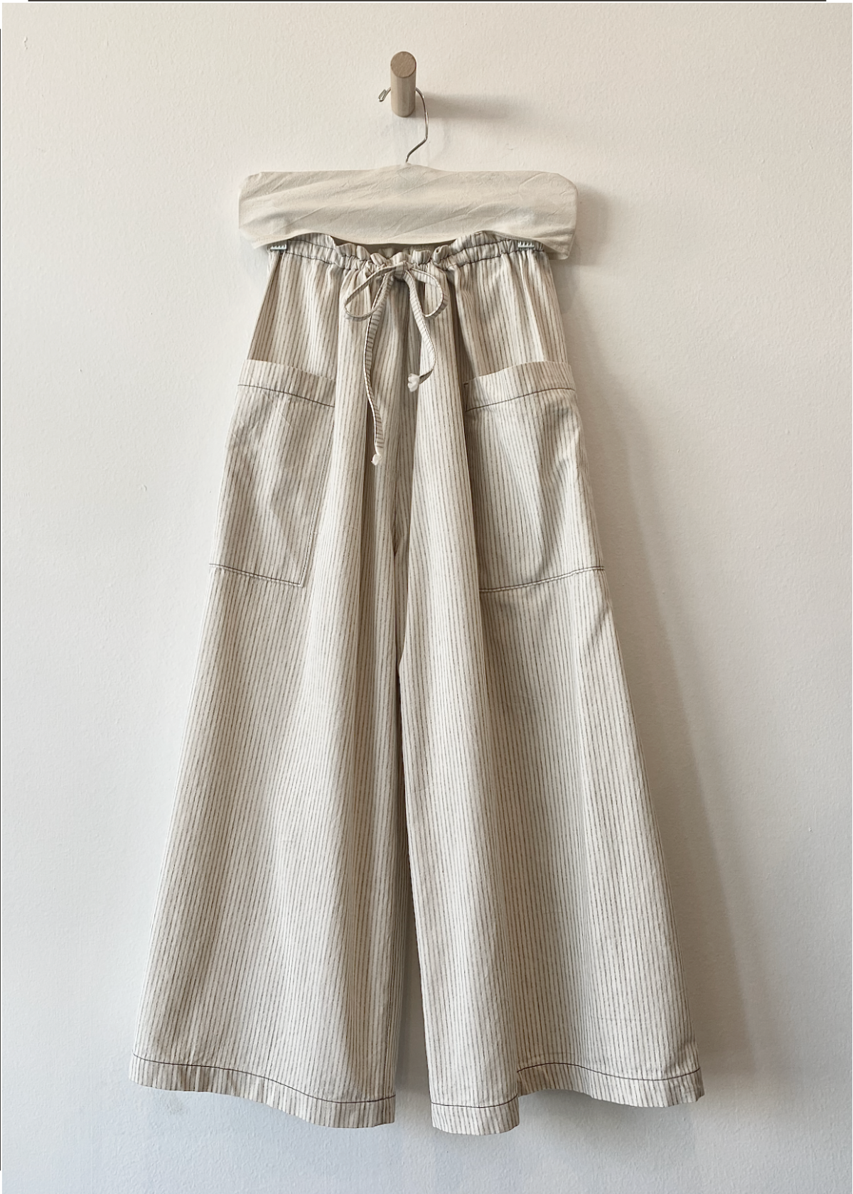 striped wide legged elastic waist pants on hanger