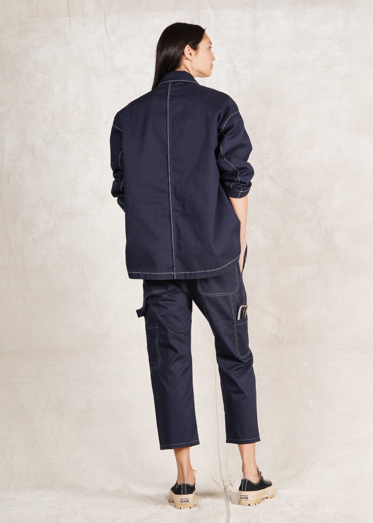 indigo cotton utility jacket buttons oversize fit with matching navy twill cropped pants rear