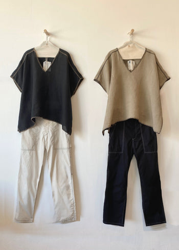 Black tunic over beige pants and dark tan tunic over black pants