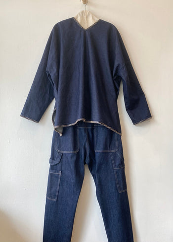 rear view of Praia denim tunic and denim maker's pants