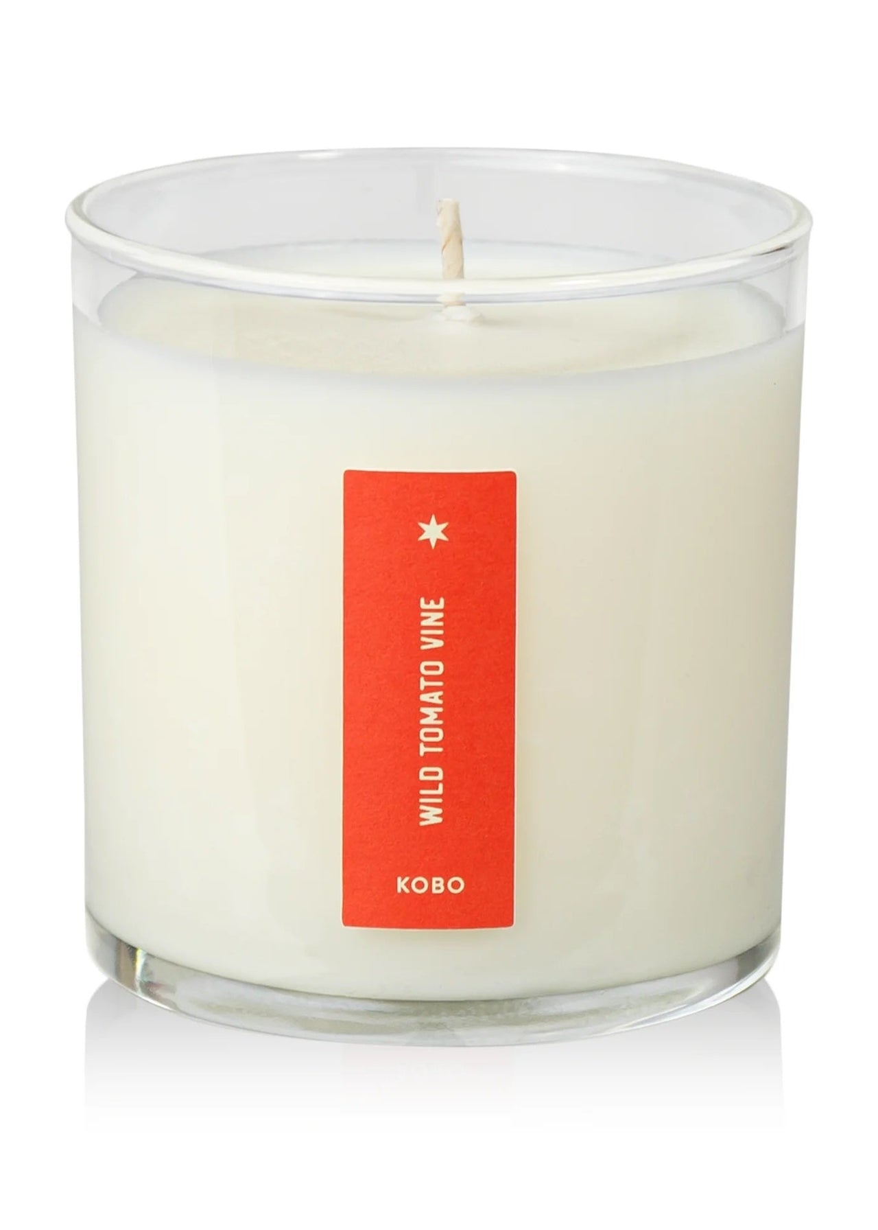 wild tomato candle next to box