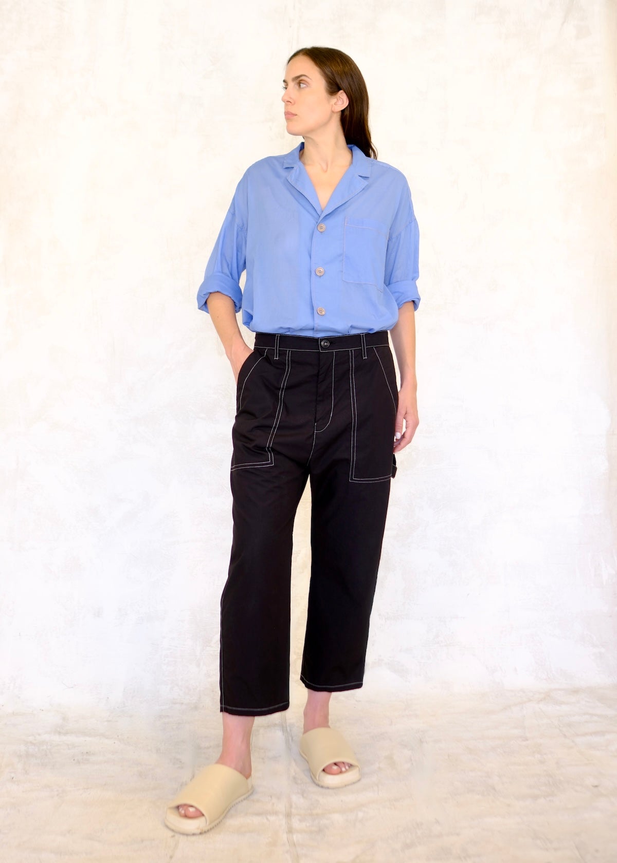 black poplin pants with large front pockets, sky blue top