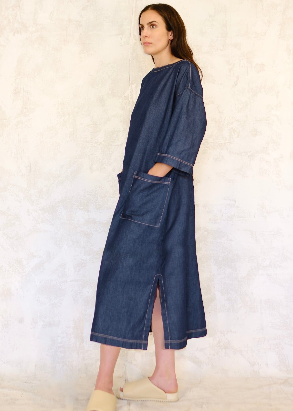 denim dress with hand in pocket side view