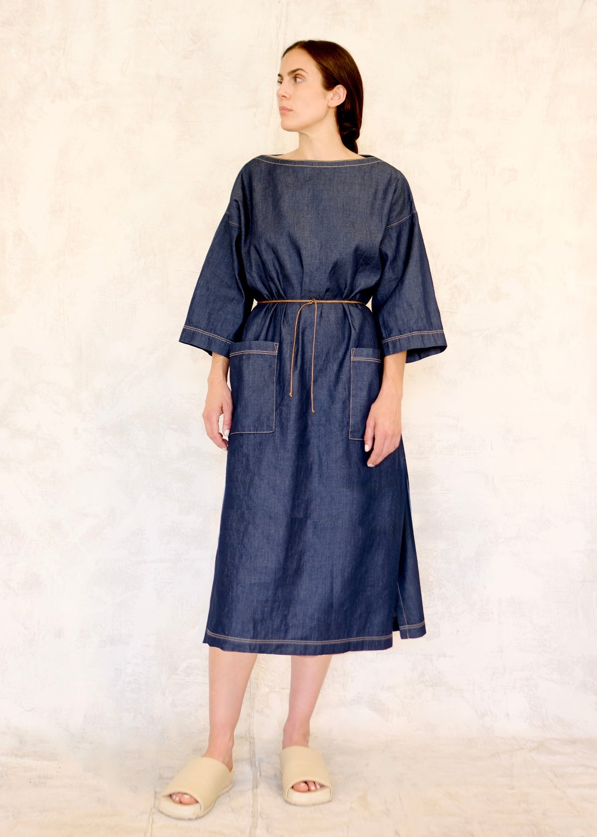 boat neck denim dress with tie belt and 2 pockets front view