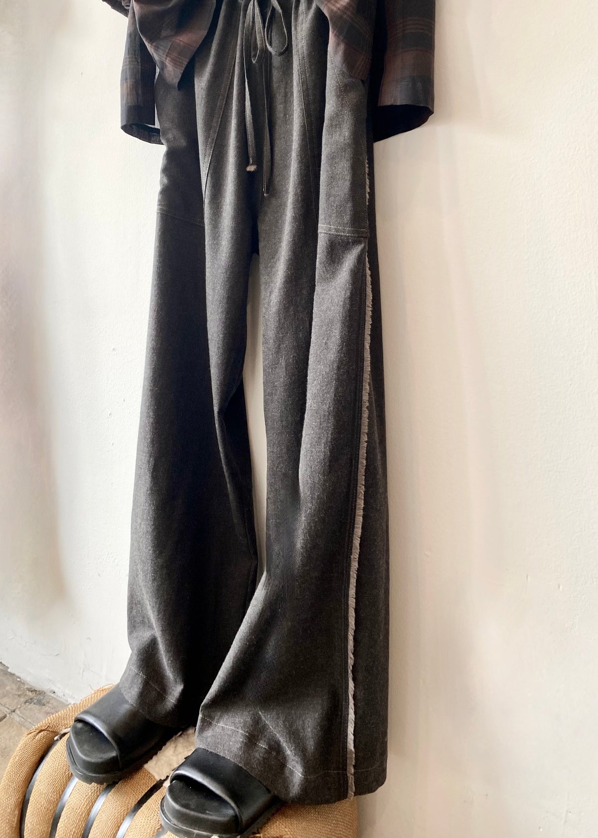 selvedge side view of long gray drawstring pants