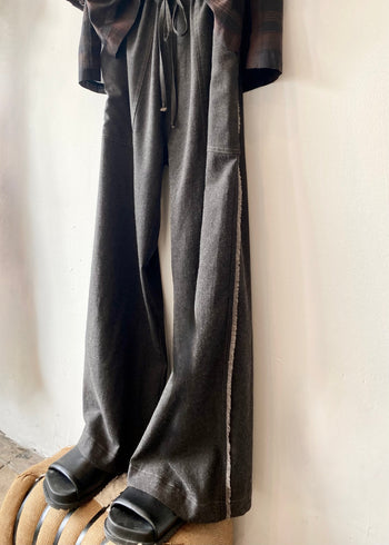 selvedge side view of long gray drawstring pants